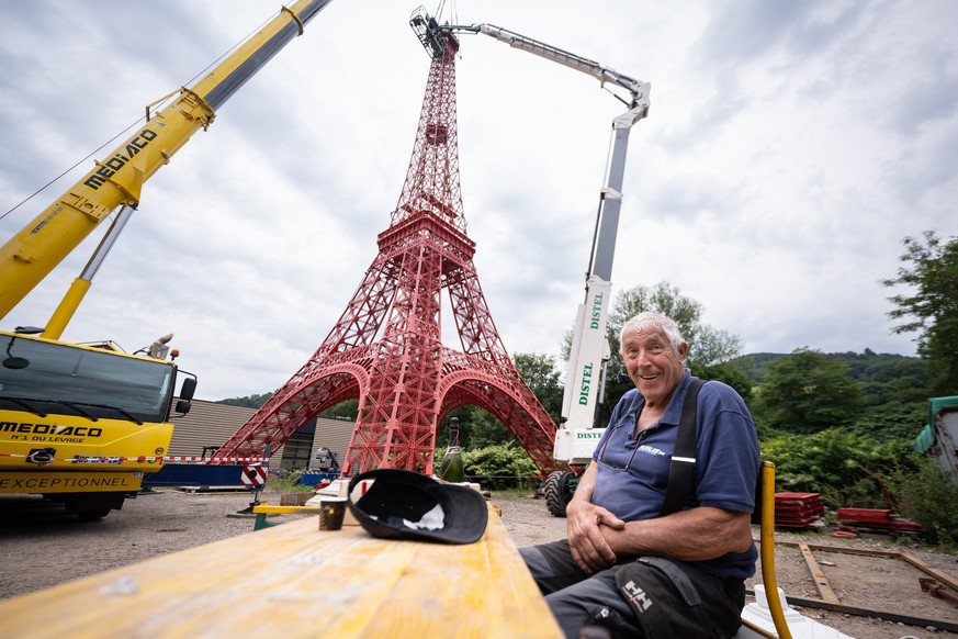 The former head of a metal parts manufacturing company Jean-Claude Fassler sits in front of his 30m Eiffel Tower replica in Sainte-Croix-aux-Mines, eastern France, on August 26, 2025. The former head  ...