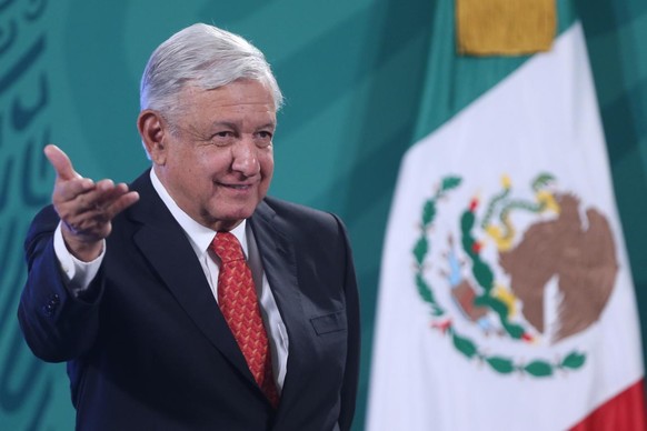 epa09217940 Mexican President Andres Manuel Lopez Obrador speaks during his morning conference at the National Palace, in Mexico City, Mexico, 21 May 2021. Lopez Obrador acknowledged that he met with  ...