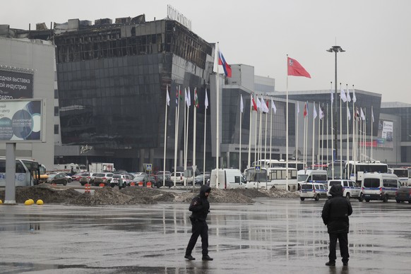 Police officers secure an area near the Crocus City Hall on the western edge of Moscow, Russia, Saturday, March 23, 2024. Assailants burst into a large concert hall in Moscow on Friday and sprayed the ...