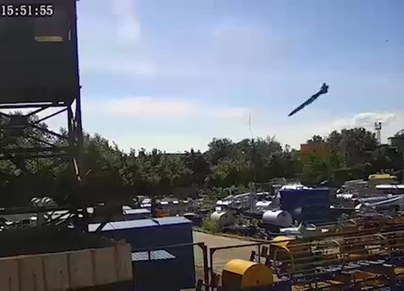 epa10040659 A grab made from a CCTV handout video made available by the Ukrainian President on 29 June 2022 shows a missile moments before hitting Amstor shopping mall in Kremenchuk, Ukraine, 27 June  ...