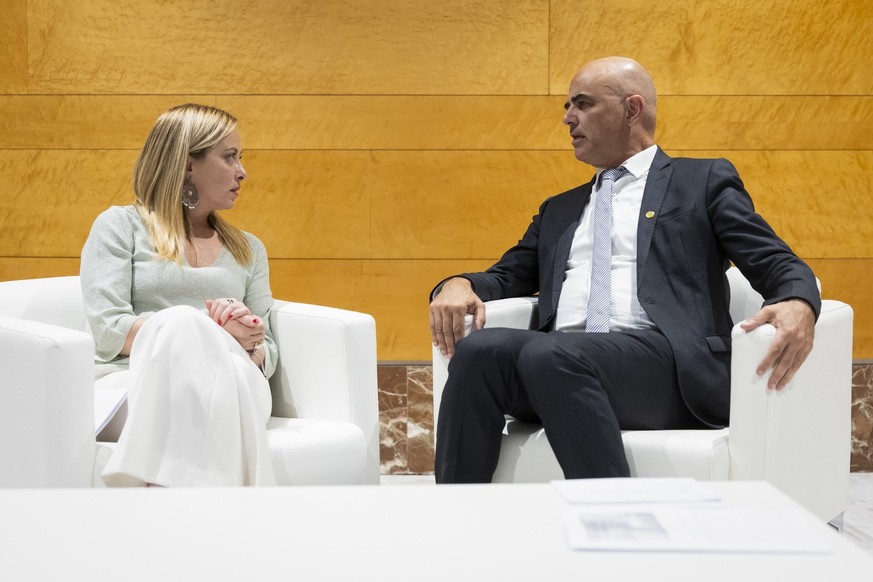 Swiss Federal President Alain Berset, right, talks to Italy's Prime Minister Giorgia Meloni, during a bilateral meeting at the European Political Community (EPC) Summit at the Congress Hall in Gr ...