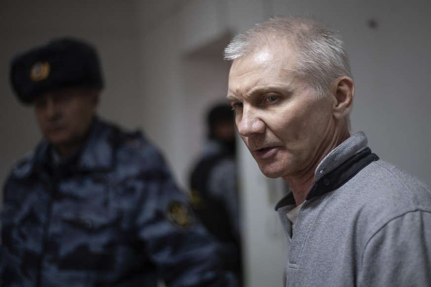 Alexei Moskalyov, right, is escorted from a courtroom in Yefremov, Tula region, some 300 kilometers (186 miles) south of Moscow, Russia, Monday, March 27, 2023. A court in Russia on Tuesday convicted  ...