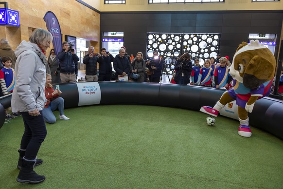 Swiss women football pioneer Madeleine Boll, plays with Maddli, the mascot of the upcoming UEFA Women&#039;s EURO 2025 football tournament, during its official unveiling at the CFF Geneva Cornavin rai ...