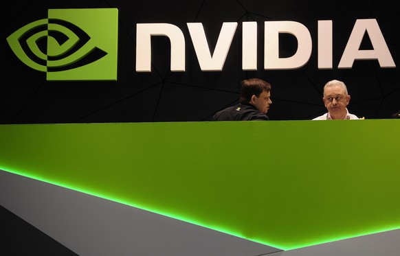 FILE - People gather in the Nvidia booth at the Mobile World Congress mobile phone trade show Thursday, Feb. 27, 2014 in Barcelona, Spain. Nvidia has joined the exclusive club of companies with a $1 t ...