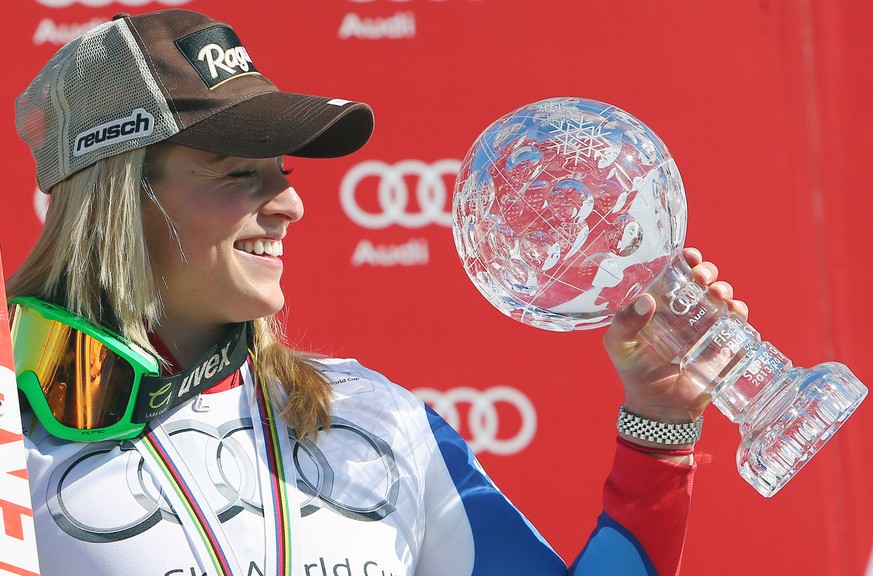 Switzerland&amp;#039;s Lara Gut shows the crystal globe trophy of the women&amp;#039;s alpine skiing Super-G at the World Cup finals in Lenzerheide, Switzerland, Thursday, March 13, 2014. (AP Photo/Ar ...