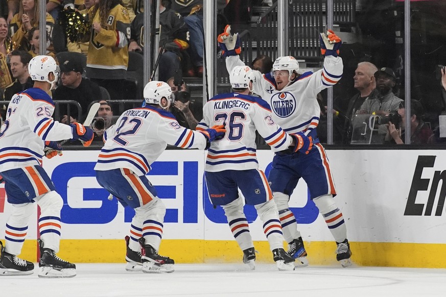 Edmonton Oilers right wing Kasperi Kapanen, right, celebrates with teammates after scoring against the Vegas Golden Knights during overtime of Game 5 of a second-round NHL hockey playoff series Wednes ...