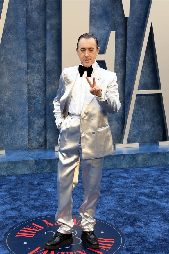 epa10519545 Alan Cumming arrives at the 2023 Vanity Fair Oscar Party following the 95th annual Academy Awards ceremony, at the Wallis Annenberg Center for the Performing Arts in Beverly Hills, Califor ...