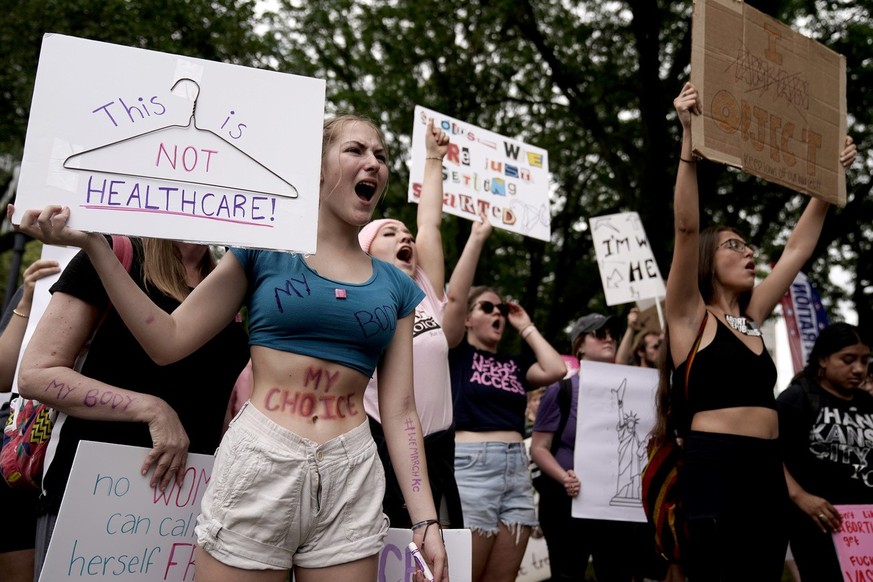 People rally in support of abortion rights Saturday, July 2, 2022, in Kansas City, Mo