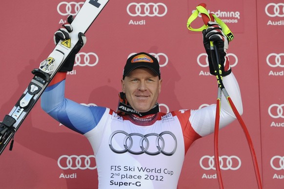 Switzerland&#039;s Didier Cuche, 2nd place of the Super G overall standing, celebrates on the podium at the Alpine Ski World Cup finals, in Schladming, Austria, Thursday, March 15, 2012. (KEYSTONE/Jea ...