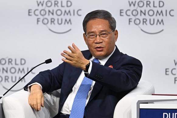 epa11436316 Chinese Premier Li Qiang speaks during the opening session of the 15th annual meeting of New Leaders of the World Economic Forum Summer in Dalian, China, 25 June 2024. EPA/Radek Pietruszka ...