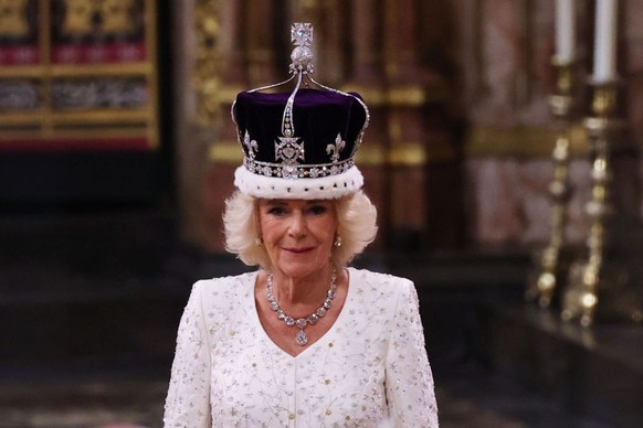 LONDON, ENGLAND - MAY 06: Queen Camilla stands after being crowned by Archbishop of Canterbury Justin Welby during her coronation ceremony in Westminster Abbey, on May 6, 2023 in London, England. The ...