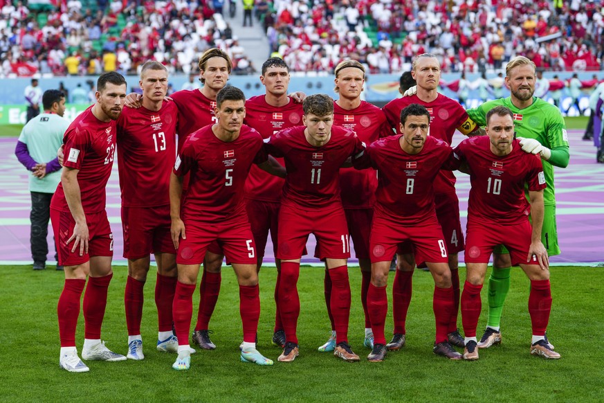 Denmark players pose for photographers prior the World Cup group D soccer match between Denmark and Tunisia, at the Education City Stadium in Al Rayyan, Qatar, Tuesday, Nov. 22, 2022. (AP Photo/Manu F ...