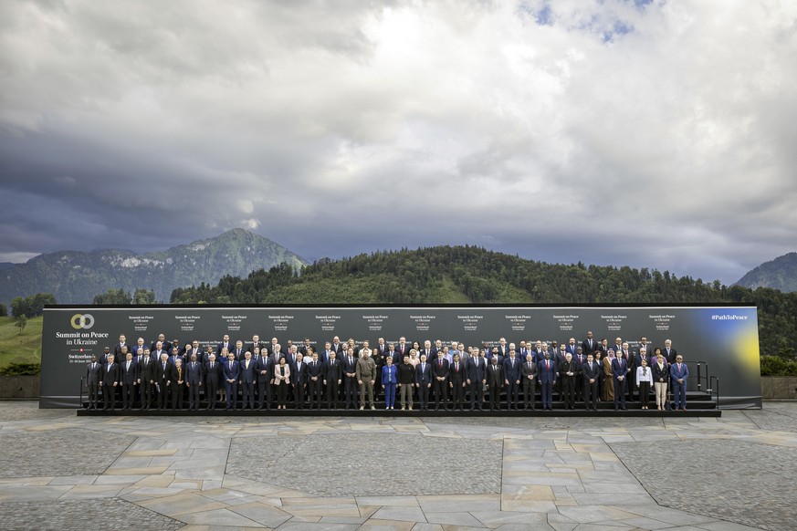 Participants pose for the group photo at the Summit on Peace in Ukraine, in Obb�rgen, Switzerland, Saturday June 15, 2024. Switzerland is hosting scores of world leaders this weekend to try to map out ...