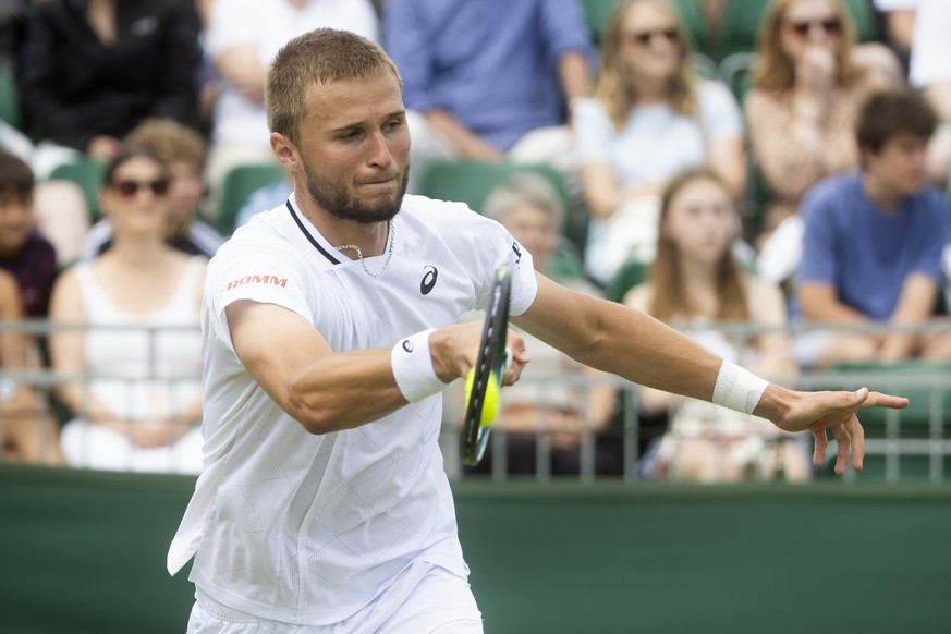 Switzerland&#039;s Leandro Riedi in action during his match against Hamish Stewart of Great Britain in the third round of the qualifying competition for the All England Lawn Tennis Championships in Wi ...