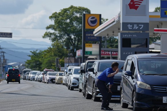 A long line of vehicles forms at a gas station as people seek fuel following an earthquake in Hikawa, Kumamoto Prefecture, southern Japan, Thursday, July 30, 2026. (AP Photo/Hiro Komae)
Japan Earthqua ...