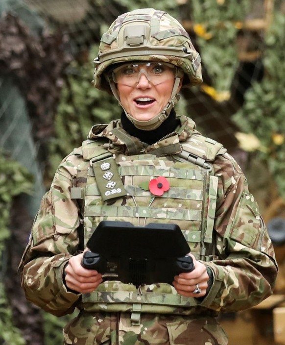 DEREHAM, ENGLAND - NOVEMBER 8: Catherine, Princess of Wales flies a drone as she visits The Queen's Dragoon Guards Regiment for the first time as their Colonel in Chief on November 8, 2023 in Der ...