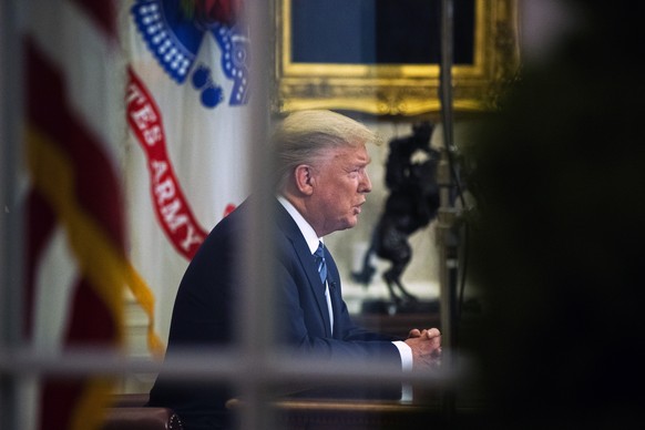 FILE - In this March 11, 2020, file photo, President Donald Trump addresses the nation from the Oval Office about the coronavirus outbreak at the White House in Washington. (AP Photo/Manuel Balce Cene ...
