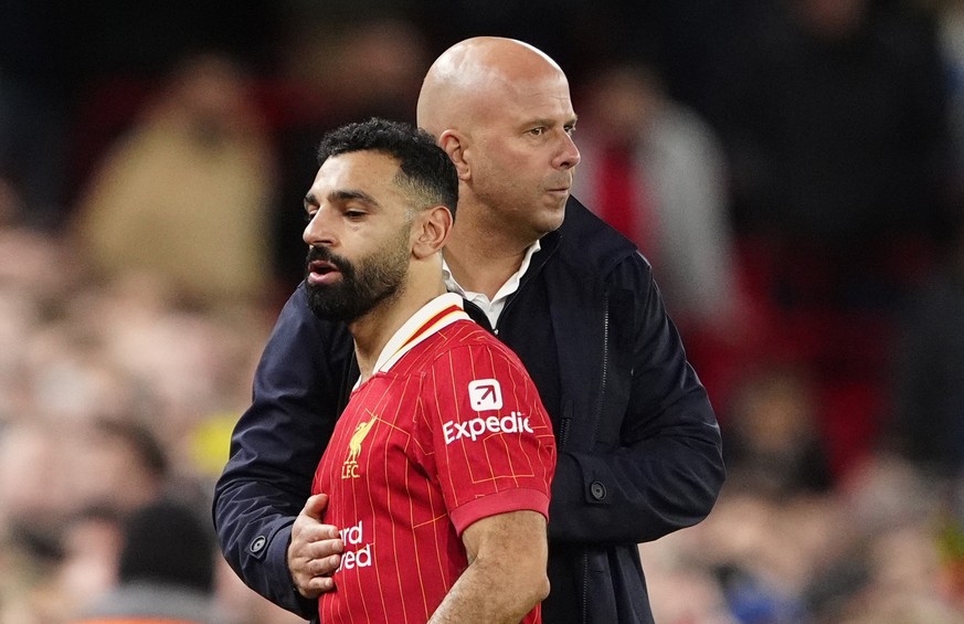 Liverpool manager Arne Slot speaks with Mohamed Salah during the Premier League match at Anfield, Liverpool. Picture date: Sunday December 1, 2024. (Photo by Peter Byrne/PA Images via Getty Images)