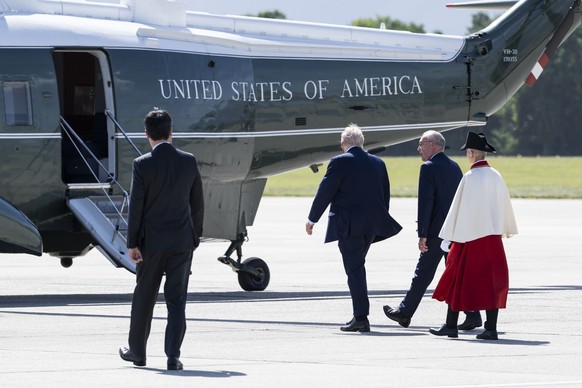 Swiss Federal President Guy Parmelin, right, welcomes US President Donald Trump, left, after Trump disembarked from Air Force One at Geneva Airport prior the G7 summit in nearby Evian (France), in Gen ...