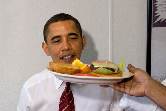 President Barack Obama is served his lunch at Ray&#039;s Hell Burger in Arlington, Virginia. (Photo by Brooks Kraft LLC/Corbis via Getty Images)