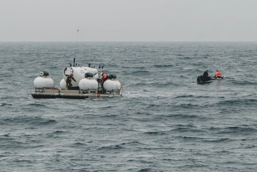 In this photo released by Action Aviation, the submersible Titan is prepared for a dive into a remote area of the Atlantic Ocean on an expedition to the Titanic on Sunday, June 18, 2023. Rescuers race ...