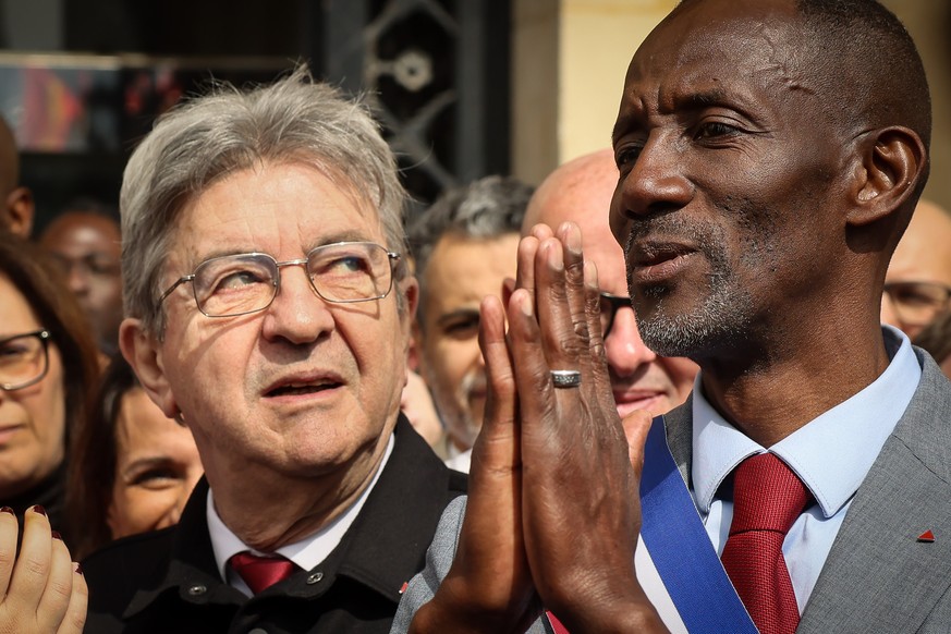 French far-left leader Jean-Luc Melenchon, left, and new Saint-Denis mayor from the far-left party La France Insoumise (LFI) Bally Bagayoko attend the rally against racism in Saint-Denis near Paris Sa ...