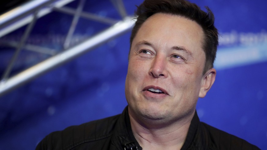 FILE - Tesla and SpaceX CEO Elon Musk arrives on the red carpet for the Axel Springer media award in Berlin on Dec. 1, 2020. A federal judge in California has dismissed a securities fraud and defamati ...