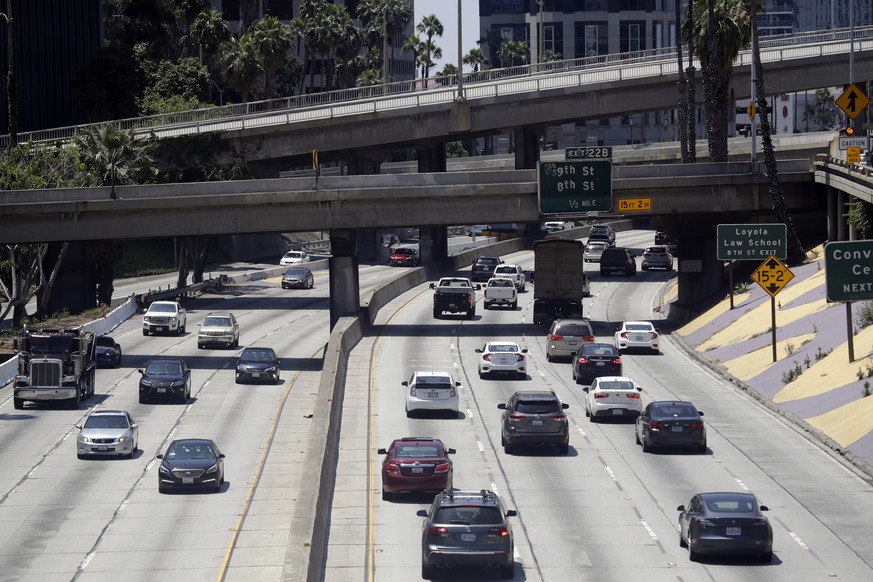 Traffic flows on California 110 on Monday, May 11, 2020, in Los Angeles. Americans are slowly getting back on the road after hunkering down amid the coronavirus pandemic, though driving still is well  ...