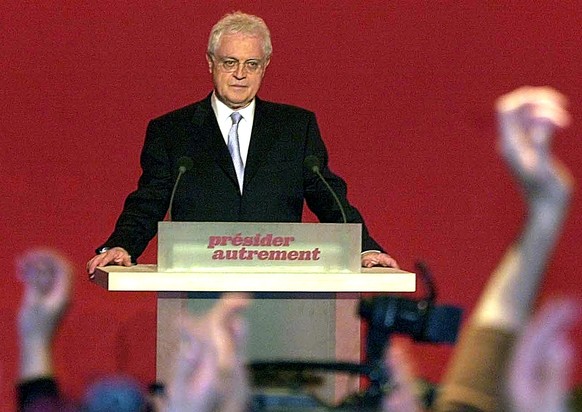 Supporters applaud as French Prime Minister and presidential candidate Lionel Jospin announces he will resign from politics, following early results of the first round of presidential elections at his ...