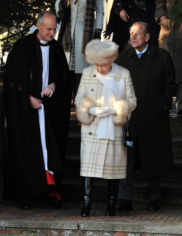 SANDRINGHAM, UNITED KINGDOM - DECEMBER 25: Queen Elizabeth II and Prince Philip, Duke of Edinburgh attend the Christmas Day Church Service with other members of the Royal family, at St Mary&#039;s Chu ...