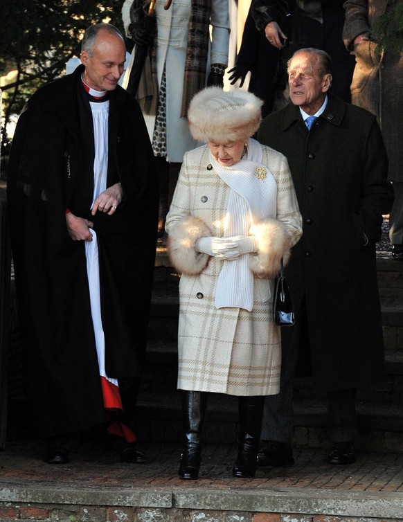 SANDRINGHAM, UNITED KINGDOM - DECEMBER 25: Queen Elizabeth II and Prince Philip, Duke of Edinburgh attend the Christmas Day Church Service with other members of the Royal family, at St Mary&#039;s Chu ...