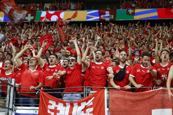 Swiss fans celebrate during a Group A match between Switzerland and Germany at the Euro 2024 soccer tournament in Frankfurt am Main, Germany, Sunday, June 23, 2024. (KEYSTONE/Peter Klaunzer)