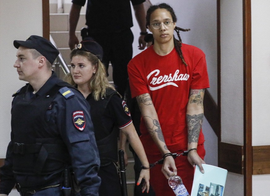 Two-time Olympic gold medalist and WNBA&#039;s Phoenix Mercury Brittney Griner (R) is escorted to a courtroom for a hearing, in Khimki City Court, outside Moscow, Russia, 07 July 2022.