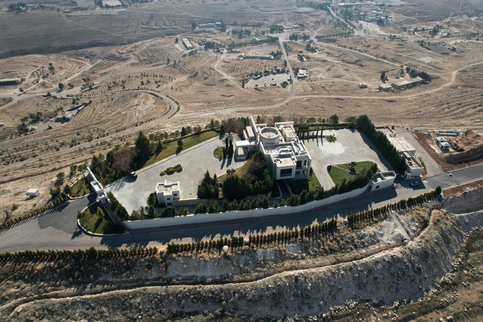 This aerial photo shows the main offices of Maher al-Assad on a hill near Damascus on January 21, 2025. Many bases of Syriaís notorious Fourth Division, a military unit led by Maher al-Assadóthe feare ...