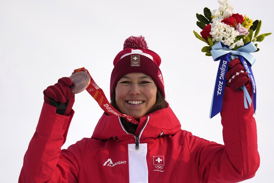 Wendy Holdener, of Switzerland celebrates with her bronze during the medal ceremony for the women&#039;s slalom at the 2022 Winter Olympics, Wednesday, Feb. 9, 2022, in the Yanqing district of Beijing ...