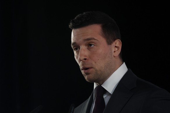 epa12822583 President of the French far-right party National Rally (RN) Jordan Bardella makes his speech following the announcement of the preliminary results from the first round of the French munici ...