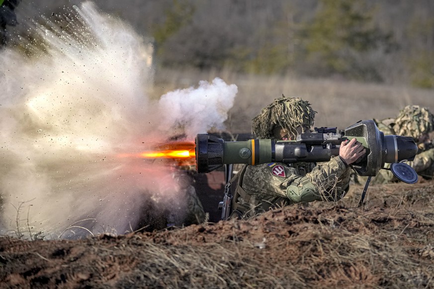 FILE - A Ukrainian serviceman fires an NLAW anti-tank weapon during an exercise in the Joint Forces Operation, in the Donetsk region, eastern Ukraine, on Feb. 15, 2022. Western weaponry pouring into U ...