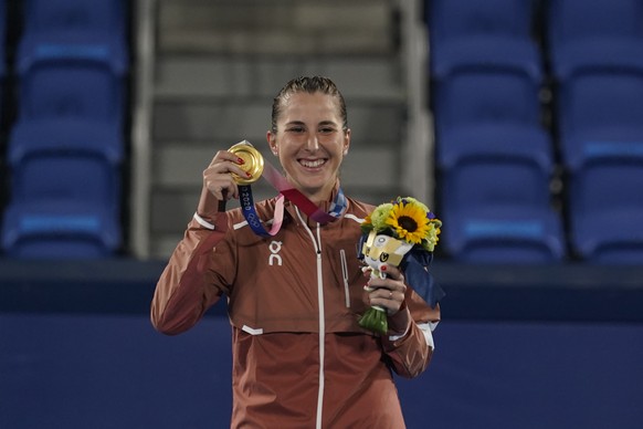 FILE - Belinda Bencic of Switzerland poses with the gold medal in the women&#039;s singles of the tennis competition at the 2020 Summer Olympics, Sunday, Aug. 1, 2021, in Tokyo, Japan. Olympic tennis  ...