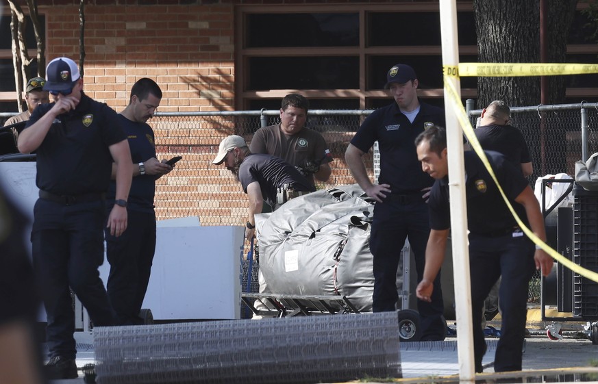 Officials continue investigations at Robb Elementary School in Uvalde, Texas, Wednesday, May 25, 2022. On Tuesday, 18-year-old Salvador Ramos entered the school and killed multiple people including st ...