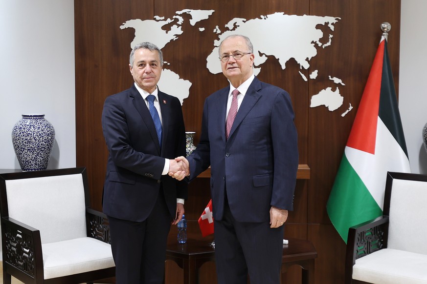 epa12169628 A handout photo made available by the Palestinian Government Press Office shows Swiss Federal Councillor and Foreign Minister Ignazio Cassis (L) meeting with Prime Minister and Minister of ...