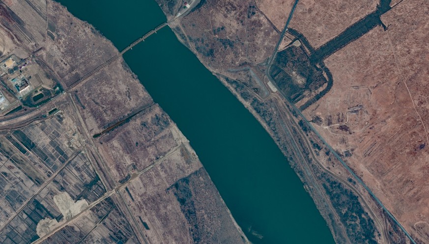 TUMANGANG, NORTH KOREA / KHASAN, RUSSIA APRIL 7, 2025: 02 Vantor Satellite imagery documents early-stage works for the planned road bridge across the Tumen River at the TumangangKhasan crossing. Earth ...