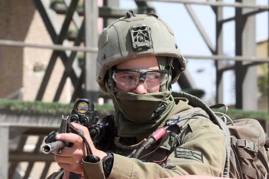 epa10495112 An armed Israeli soldier keeps watch in the West Bank town of Hawara, near the city of Nablus, 28 February 2023. Israeli security forces have been conducting searches in the area and set u ...