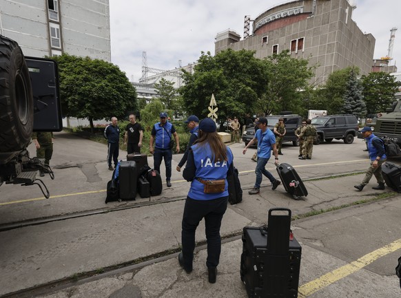 epa10692573 A picture taken during a visit to Enerhodar organised by the Russian Defence ministry shows International Atomic Energy Agency (IAEA) members arrive to Zaporizhzhia Nuclear Power Plant in  ...