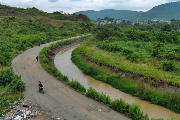 This aerial view shows what is popularly known as the Canal de la Muerte (Death Canal), in northwest Guayaquil, Ecuador, on June 12, 2026. Hundreds of bodies linked to kidnapping victims, criminal act ...