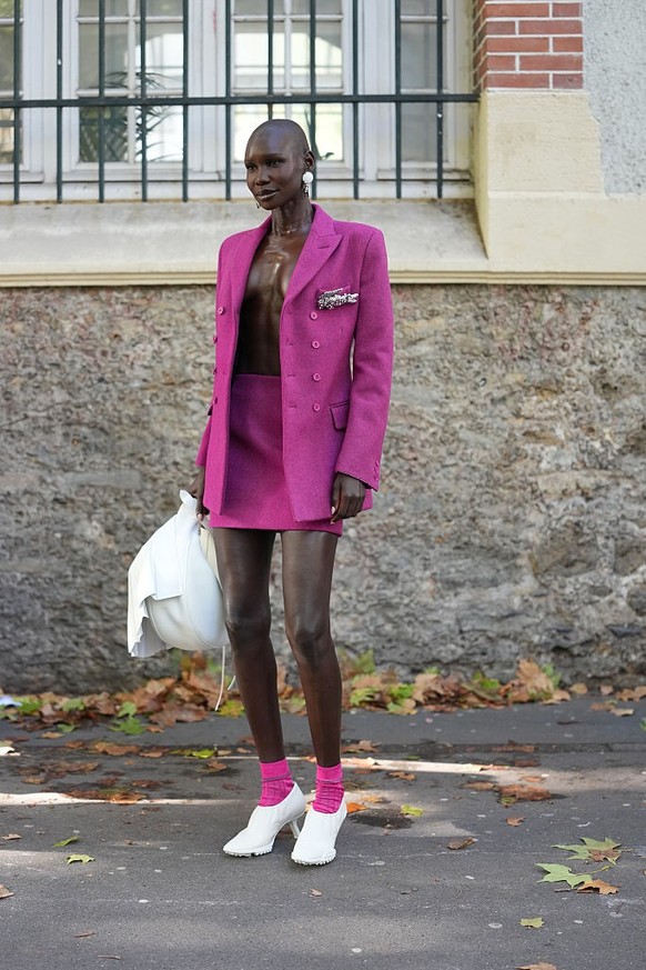 BERLIN, GERMANY - DECEMBER 10: Sonia Lyson is seen wearing black, oval-shaped Vehla sunglasses. Her outfit is cream-colored, consisting of a long, oversized faux fur coat that reaches her ankles. Unde ...
