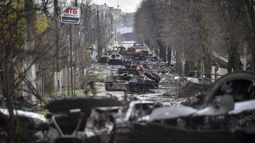 epaselect epa09866795 General view of a street with destroyed Russian military machinery in the areas recaptured by the Ukrainian army in the city of Kyiv (Kiev), Ukraine, 02 April 2022. Dmitrivka and ...