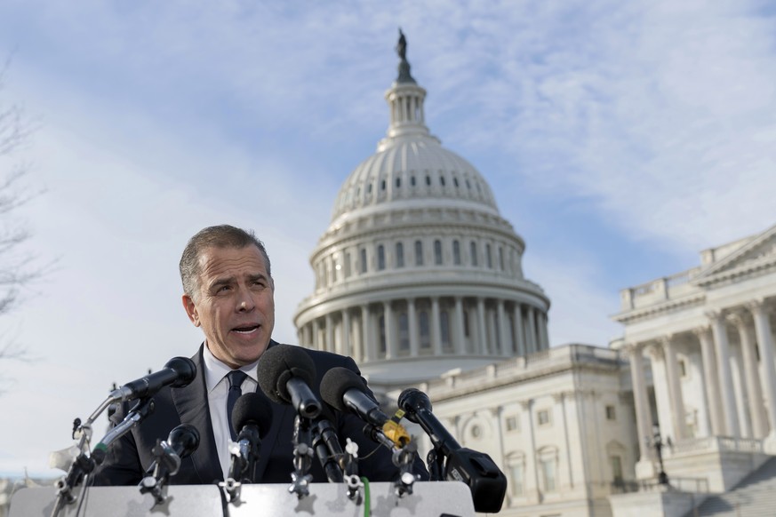 Hunter Biden, son of President Joe Biden, talks to reporters at the U.S. Capitol, in Washington, Wednesday, Dec. 13, 2023. Hunter Biden lashed out at Republican investigators who have been digging int ...