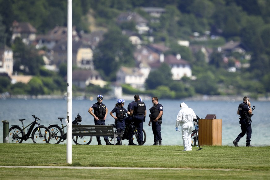 Security forces examine the scene of knife attack in Annecy, French Alps, Thursday, June 8, 2023. An attacker with a knife stabbed several young children and at least one adult, leaving some with life ...