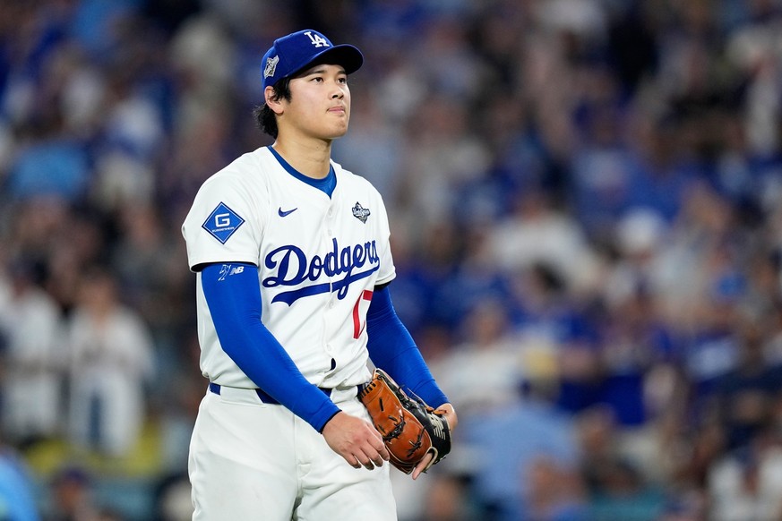 Los Angeles Dodgers pitcher Shohei Ohtani walks to the dugout against the Toronto Blue Jays during the fifth inning in Game 4 of baseball&#039;s World Series, Tuesday, Oct. 28, 2025, in Los Angeles. ( ...