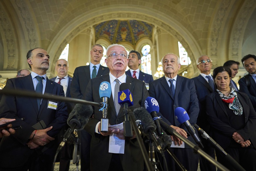 Palestinian foreign policy advisor Riad Malki speaks to media at the International Court of Justice, or World Court, in The Hague, Netherlands, Friday, July 19, 2024. The top U.N. court said Friday th ...
